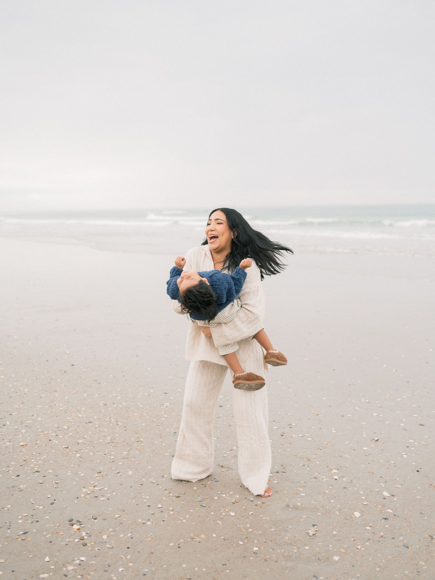 Mom twirling with son during dauphin island beach photography session