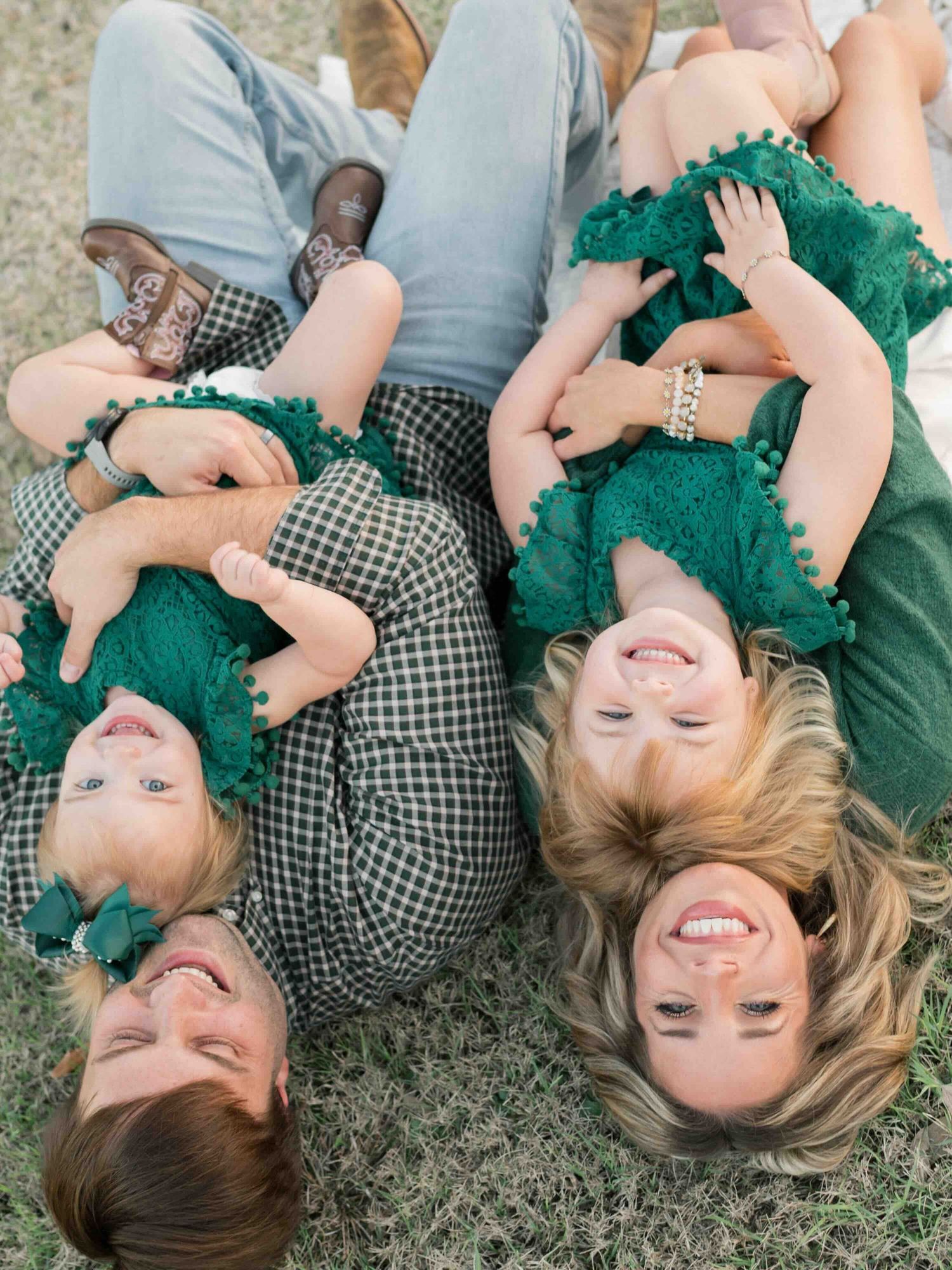 family snuggling and laughing during family session in mobile, alabama