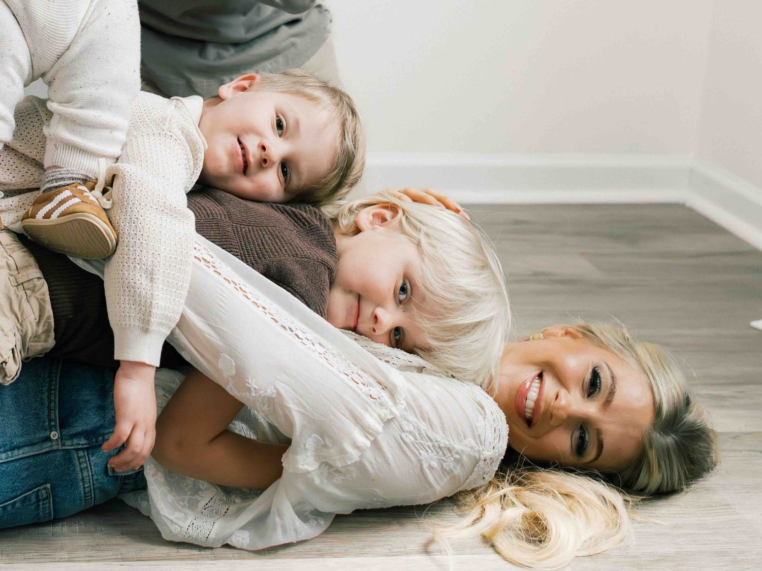 Parents and children playing together during family photography session in Mobile Alabama