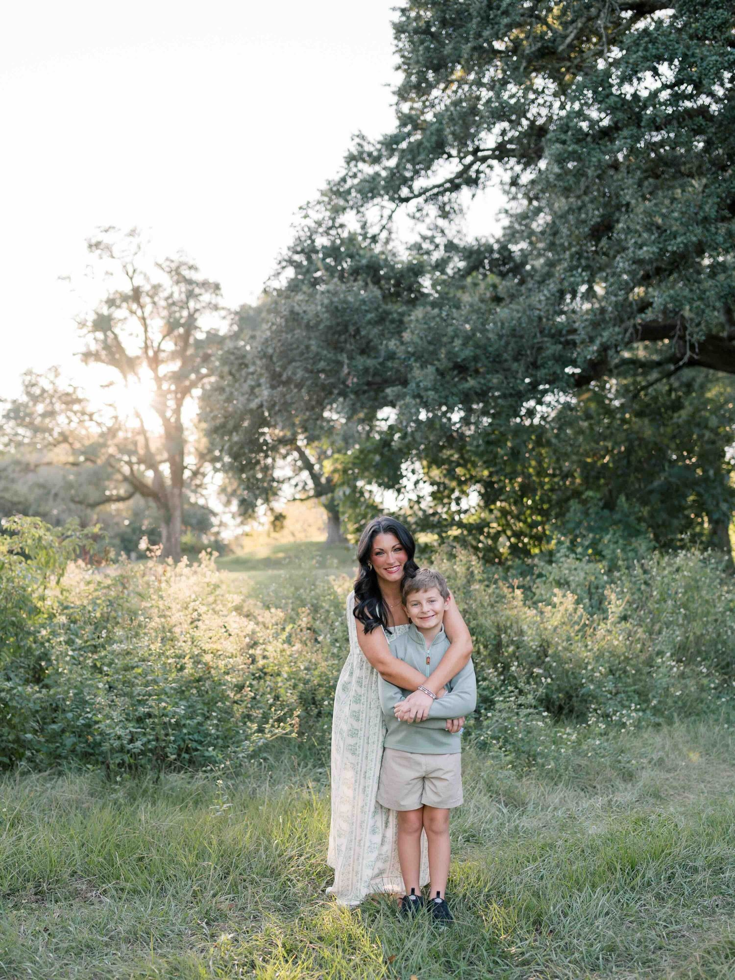 Family photographer capturing candid moment between mom and son at Springhill college