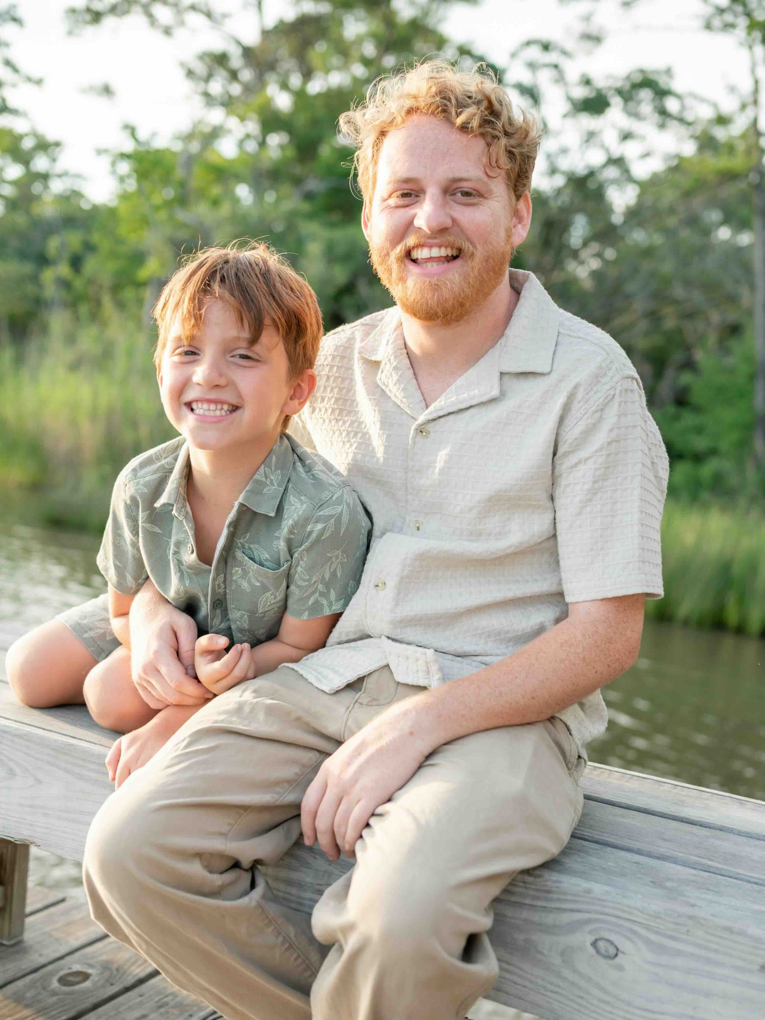 Son and father wearing coordinated outfits during a golden hour session in Mobile alabama