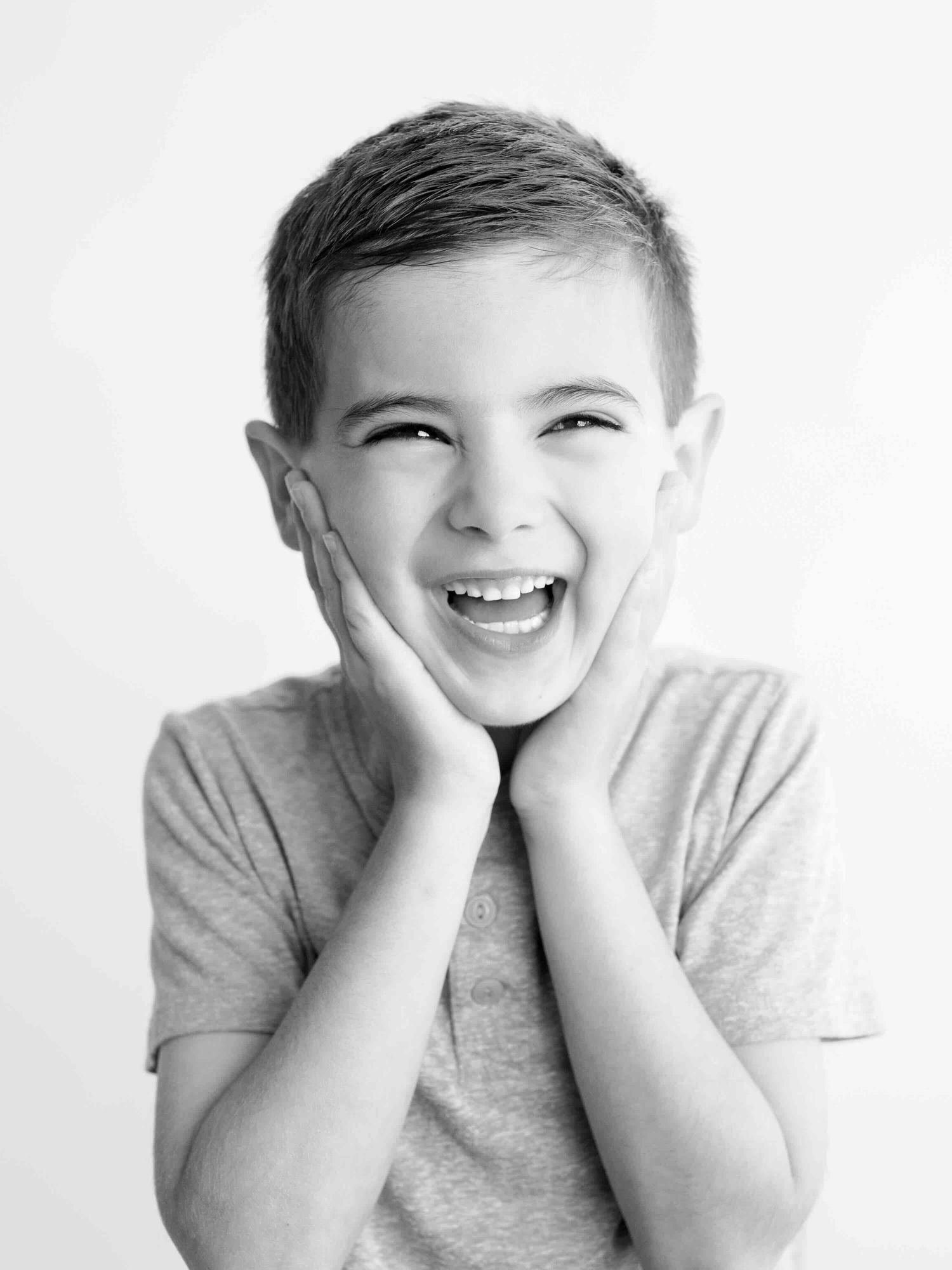Child making silly face during personality portrait photography in Mobile Alabama