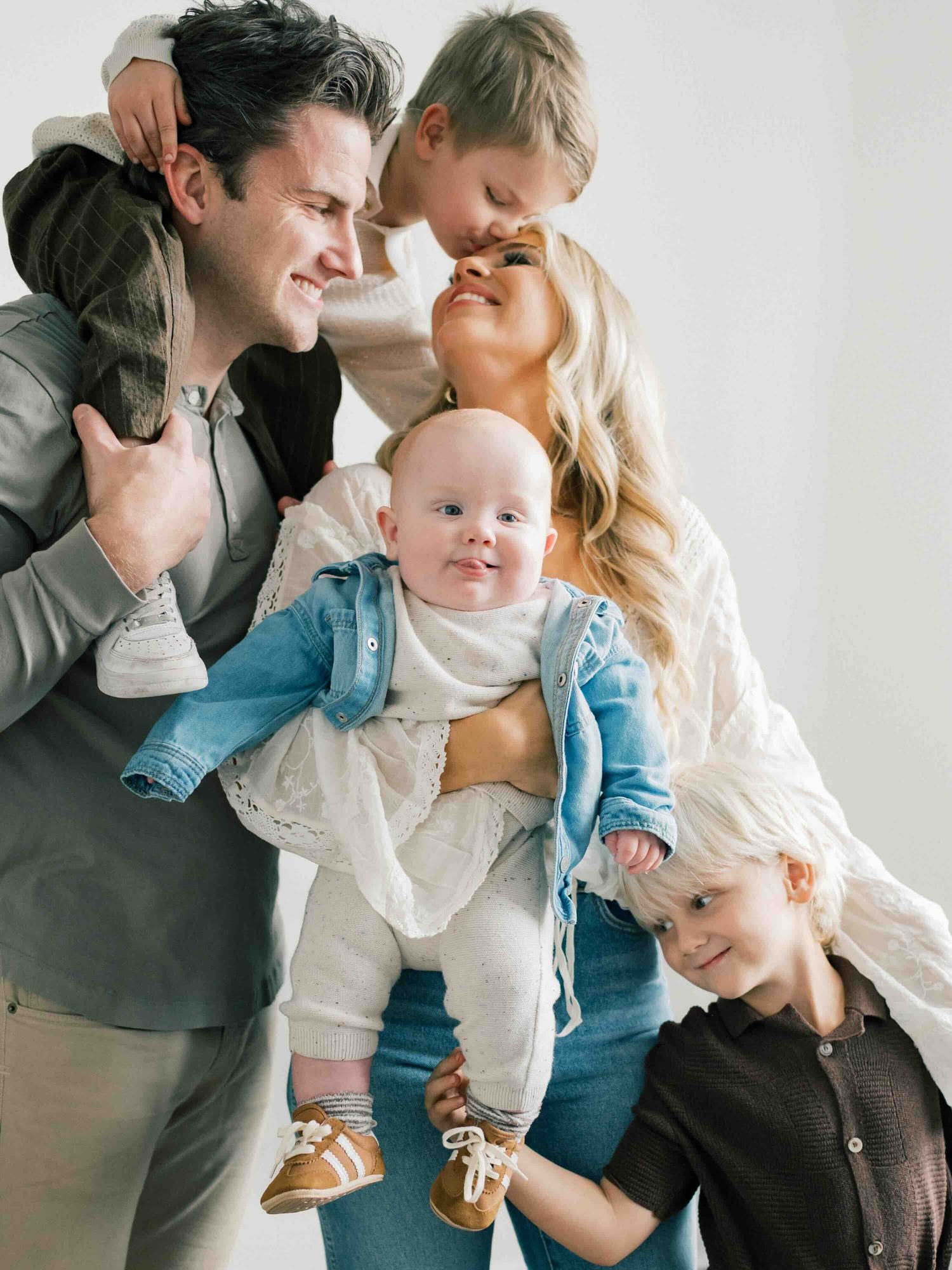 Family laughing together during outdoor photography session in Fairhope Alabama