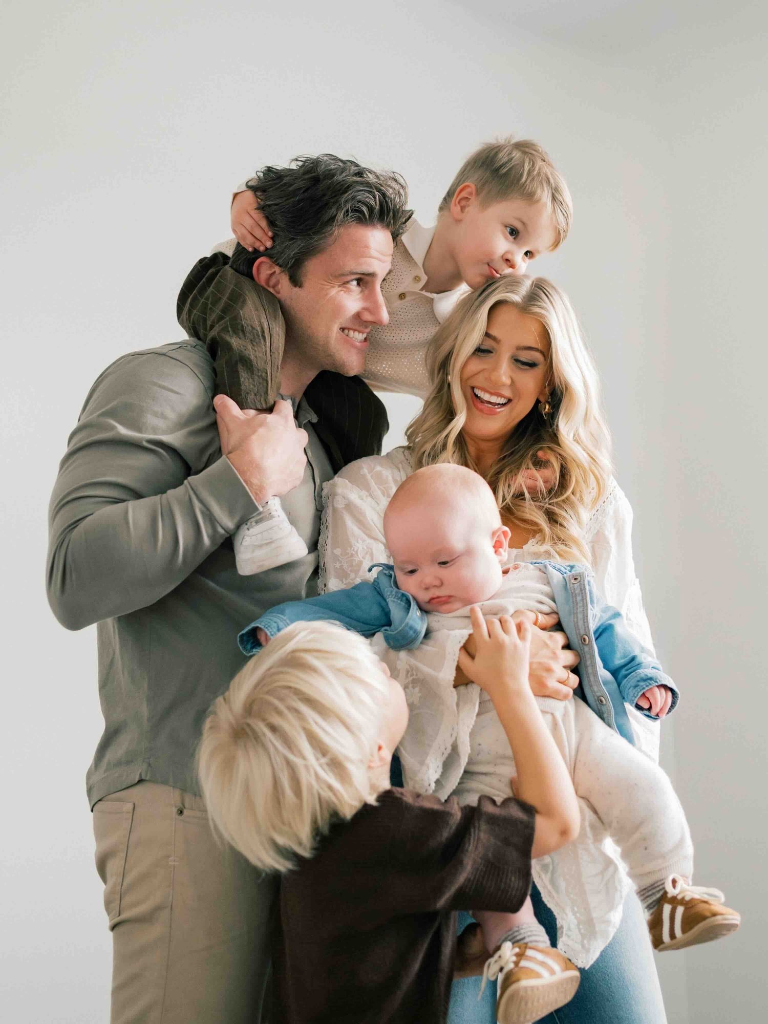 Family group hug and laughs during family photography session in Mobile Alabama