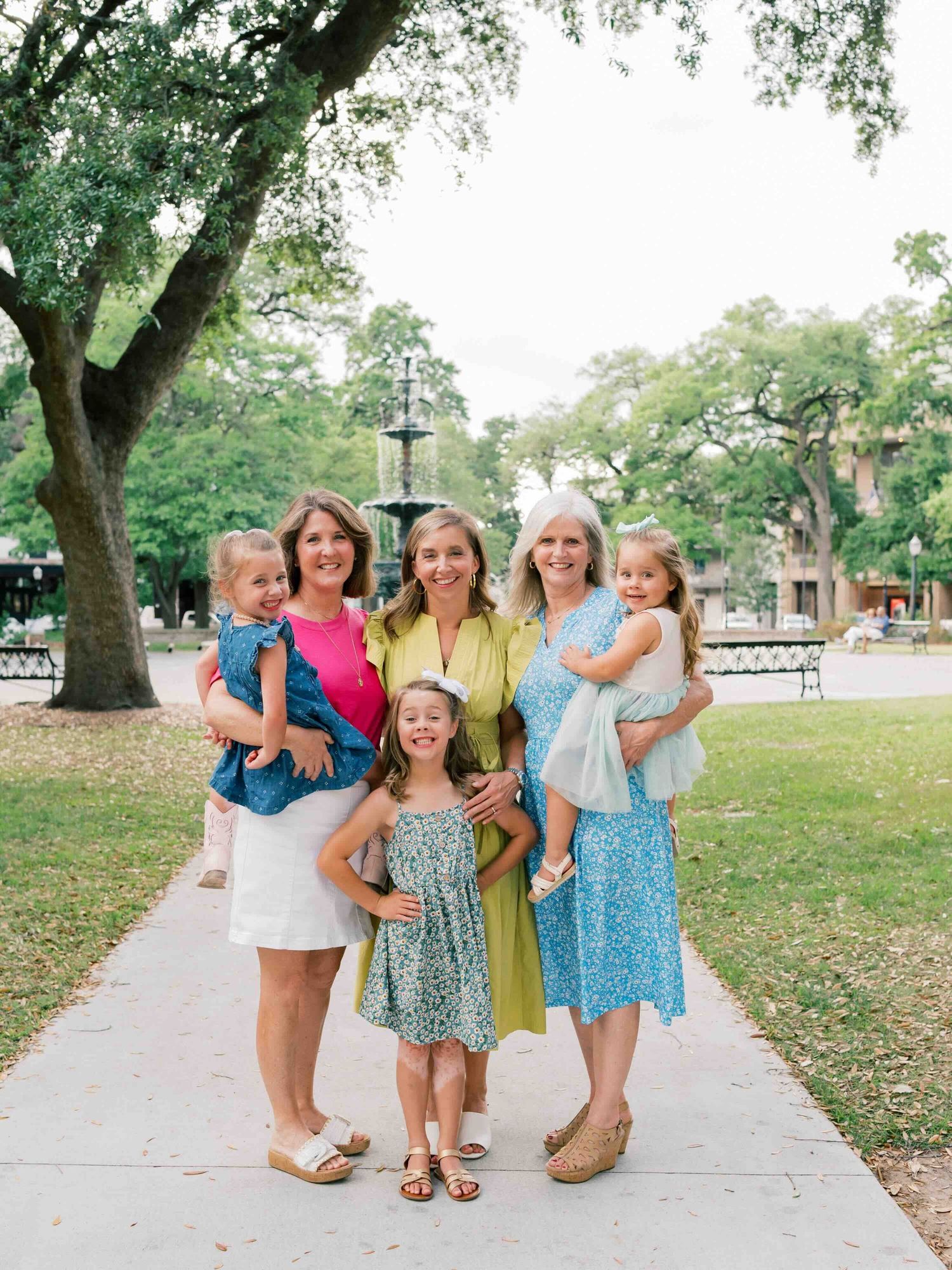 Natural light family photography session with mother and daughters in Bienville Square in Mobile, Alabama