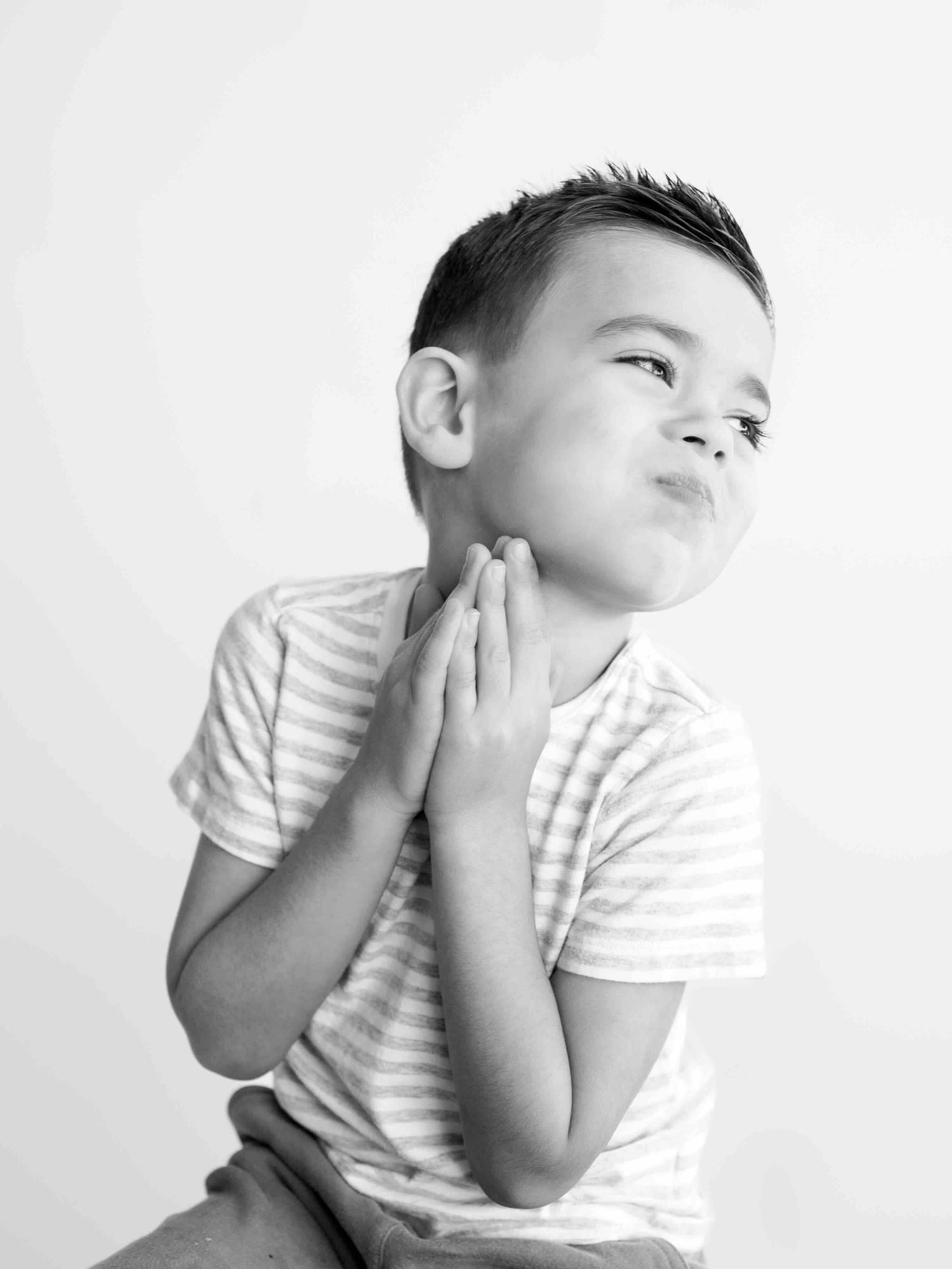 Young boy laughing during kids personality portrait session in Mobile Alabama