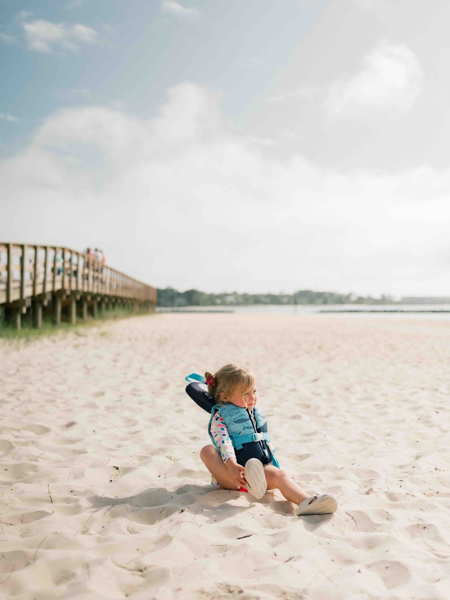 Gulf Coast extended family photography session on Dauphin Island with candid moments on the beach
