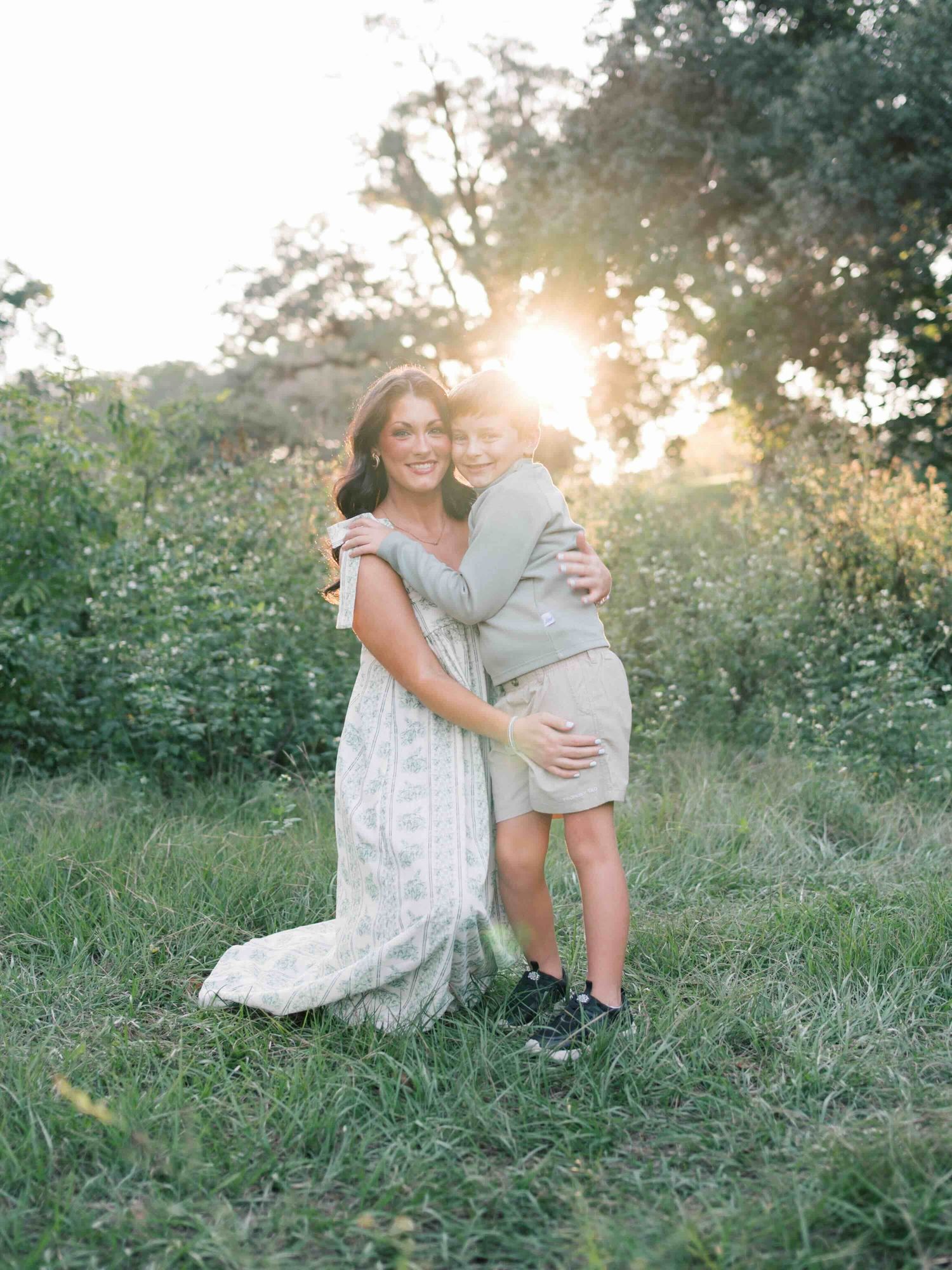 Mother hugging young son during family photography session in Mobile Alabama