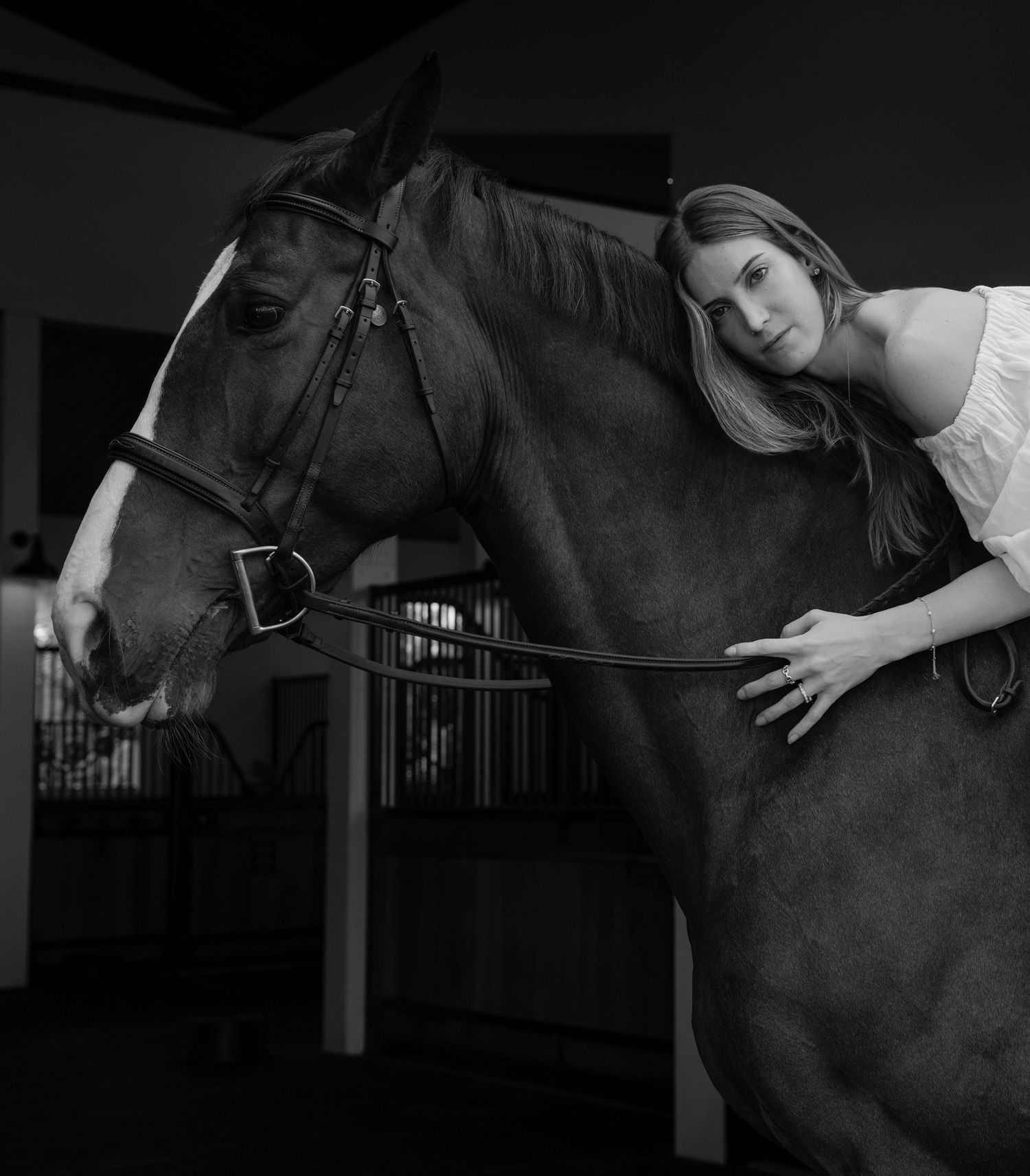 Elegant close-up portrait of a woman and her horse sharing a quiet moment, captured with artistic precision in The Bahamas.