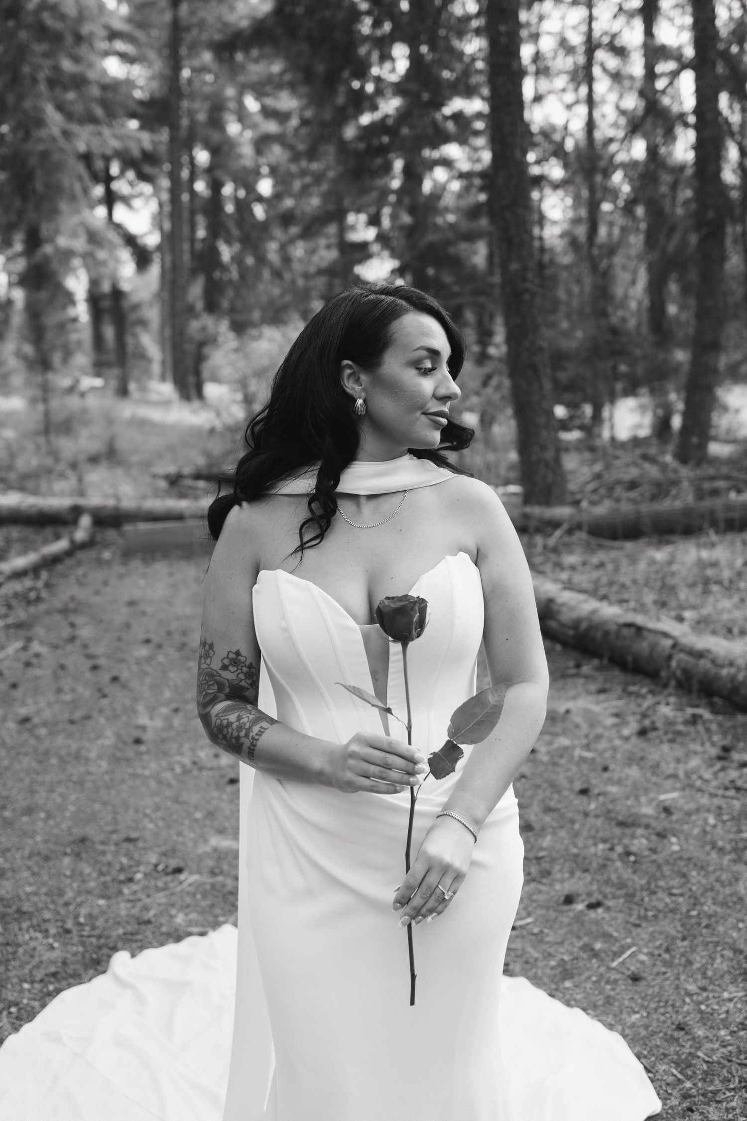Elegant bridal portraits in a serene forest setting with natural light.