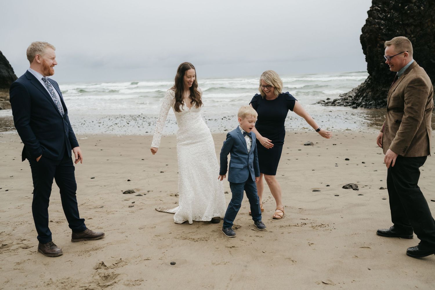 A candid moment during beach wedding celebrations with family members.