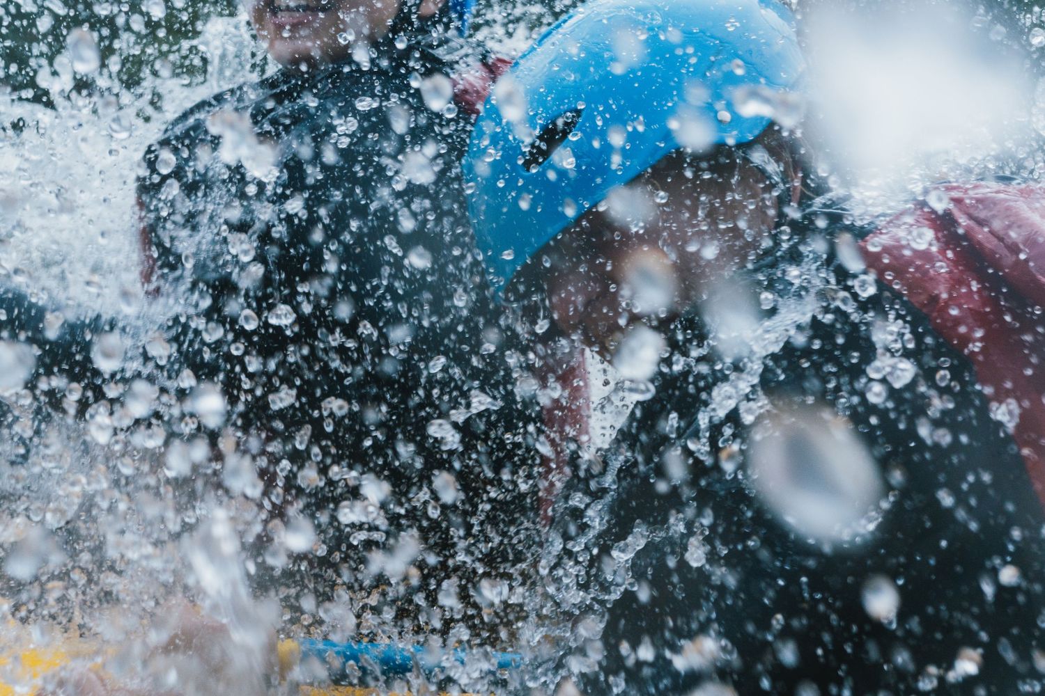 People getting splashed with water during Songkran water festival celebration.