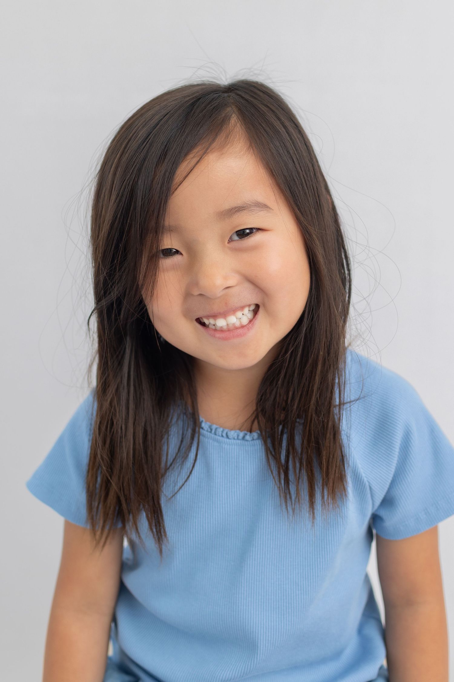 Elementary school boy looking directly at camera during individual portrait session