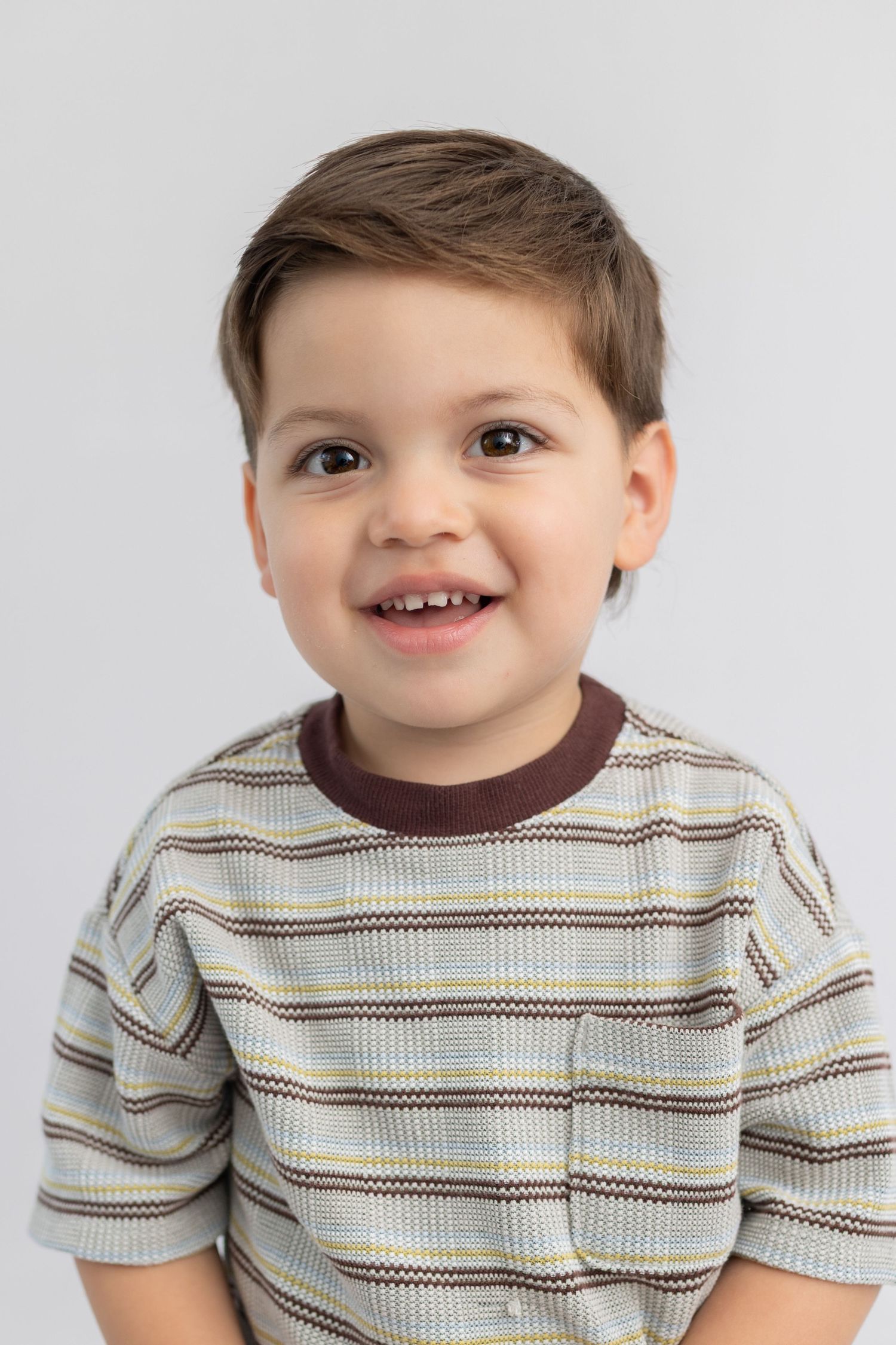 Unposed school photo of child grinning, boutique school photography Orange County