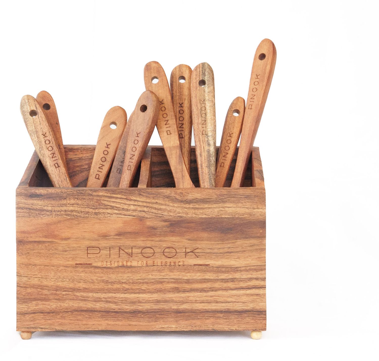 Pinook branded wooden utensil holder box with multiple wooden spatulas and tools organized inside.
