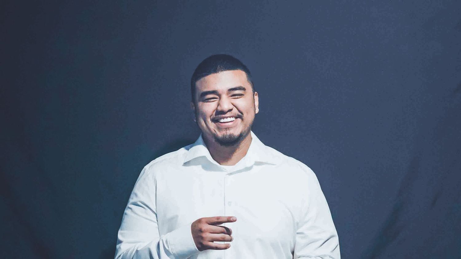 Series of expressive professional portraits with navy background.