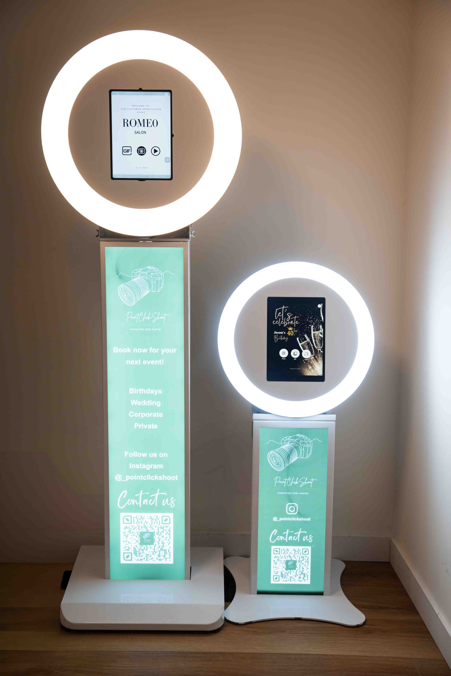 Illuminated photo booth station featuring ring lights and interactive digital menu displays.