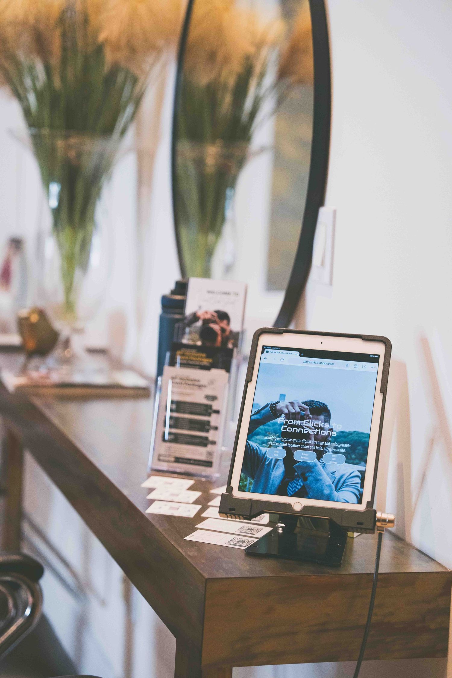 Professional salon workstations with digital displays and floral arrangements.