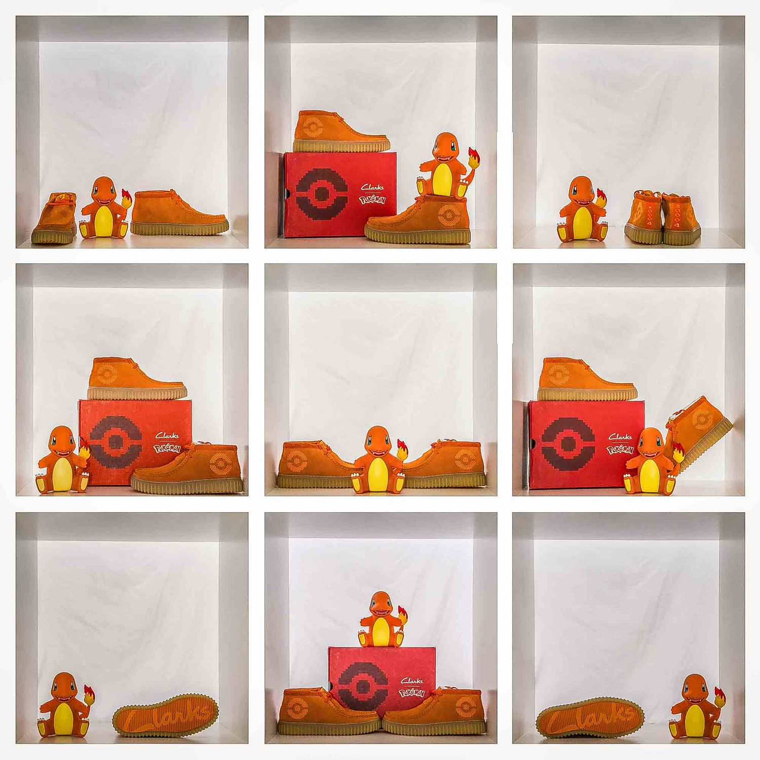 Orange and red Pokemon shoes displayed with Pikachu figures on white shelving.