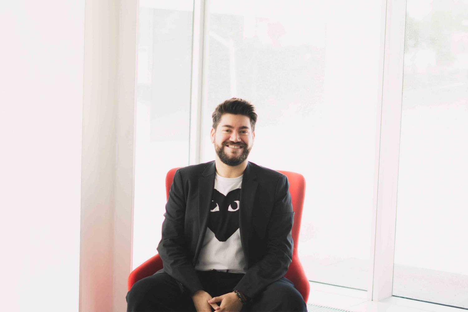 Business casual portraits in bright modern office with window views.