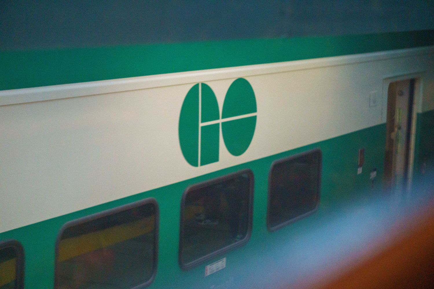 Abstract view of green and white geometric lines and shapes on a wall or surface.