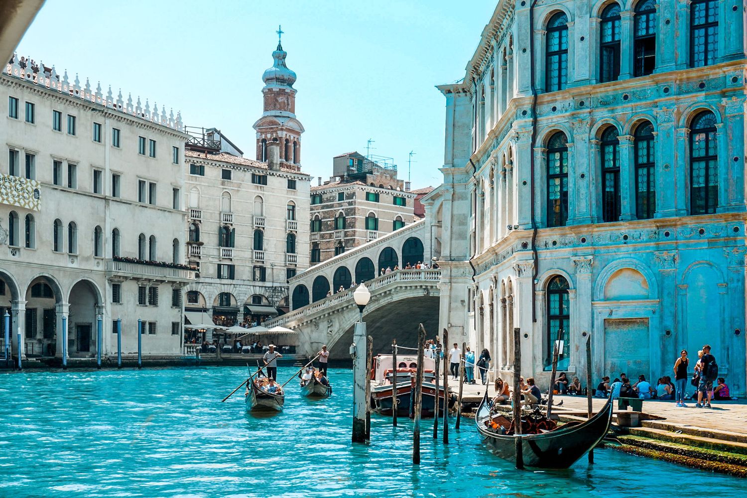Series of Venetian canals with traditional gondolas and historic architecture along the waterways.