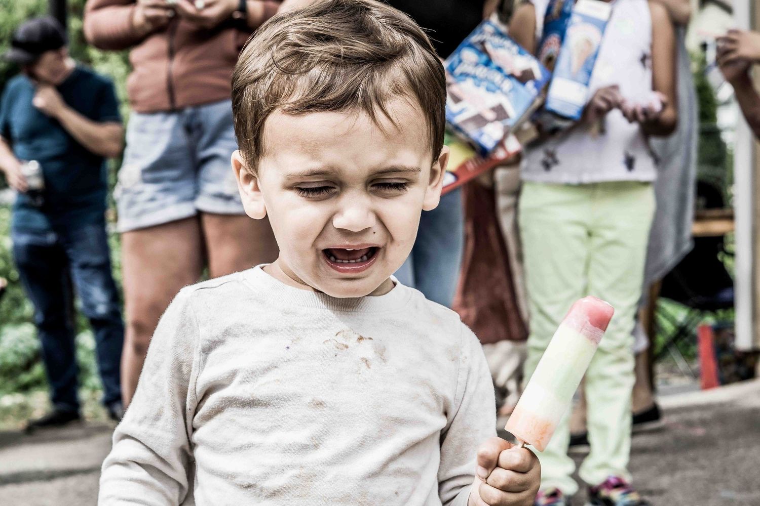 Young child shows various excited facial expressions in a series of candid shots.