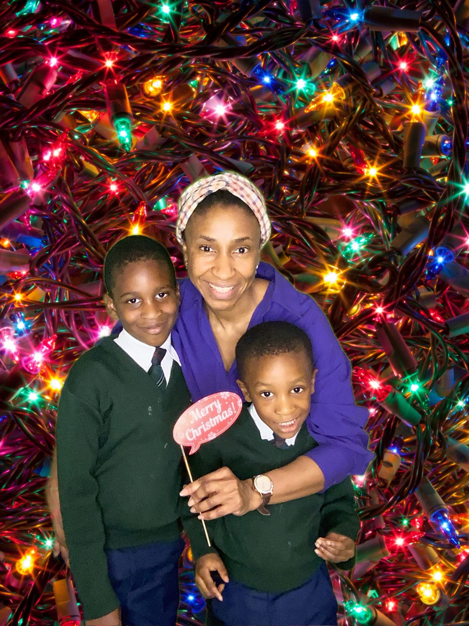 A holiday portrait with colorful Christmas lights in the background.