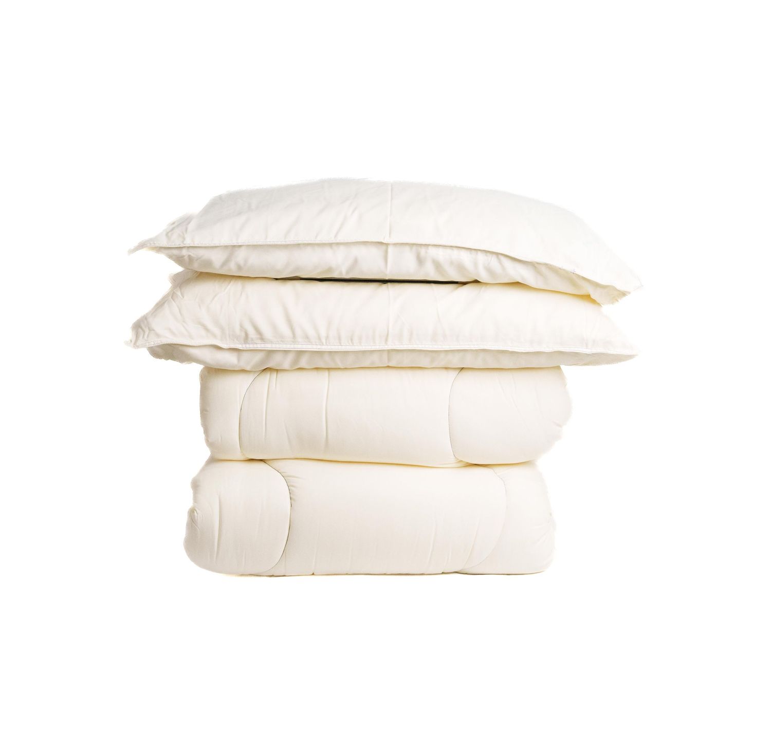 Stacked cream white down comforter set with two pillows and bolster on white background.