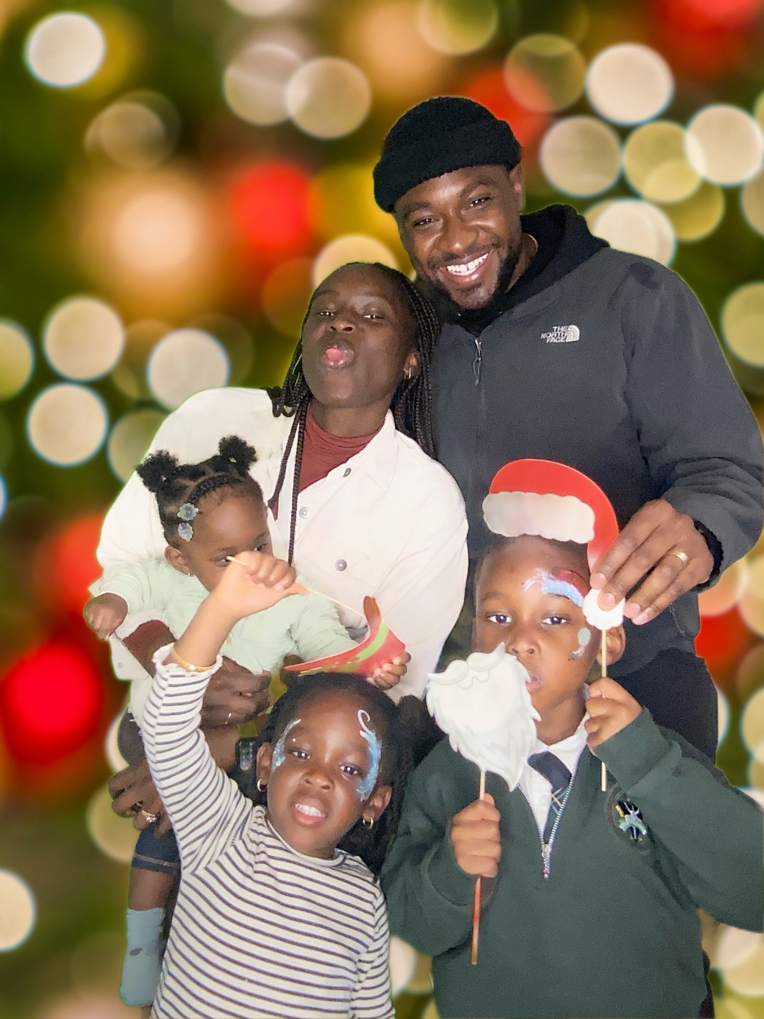 A festive holiday portrait with props against a bokeh background.
