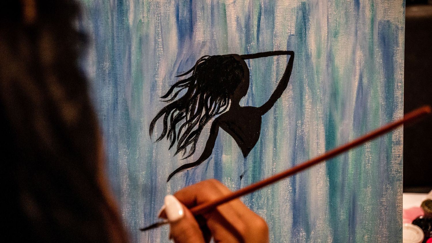 Hand-drawn animation sequence showing flowing hair movement in blue and black ink.