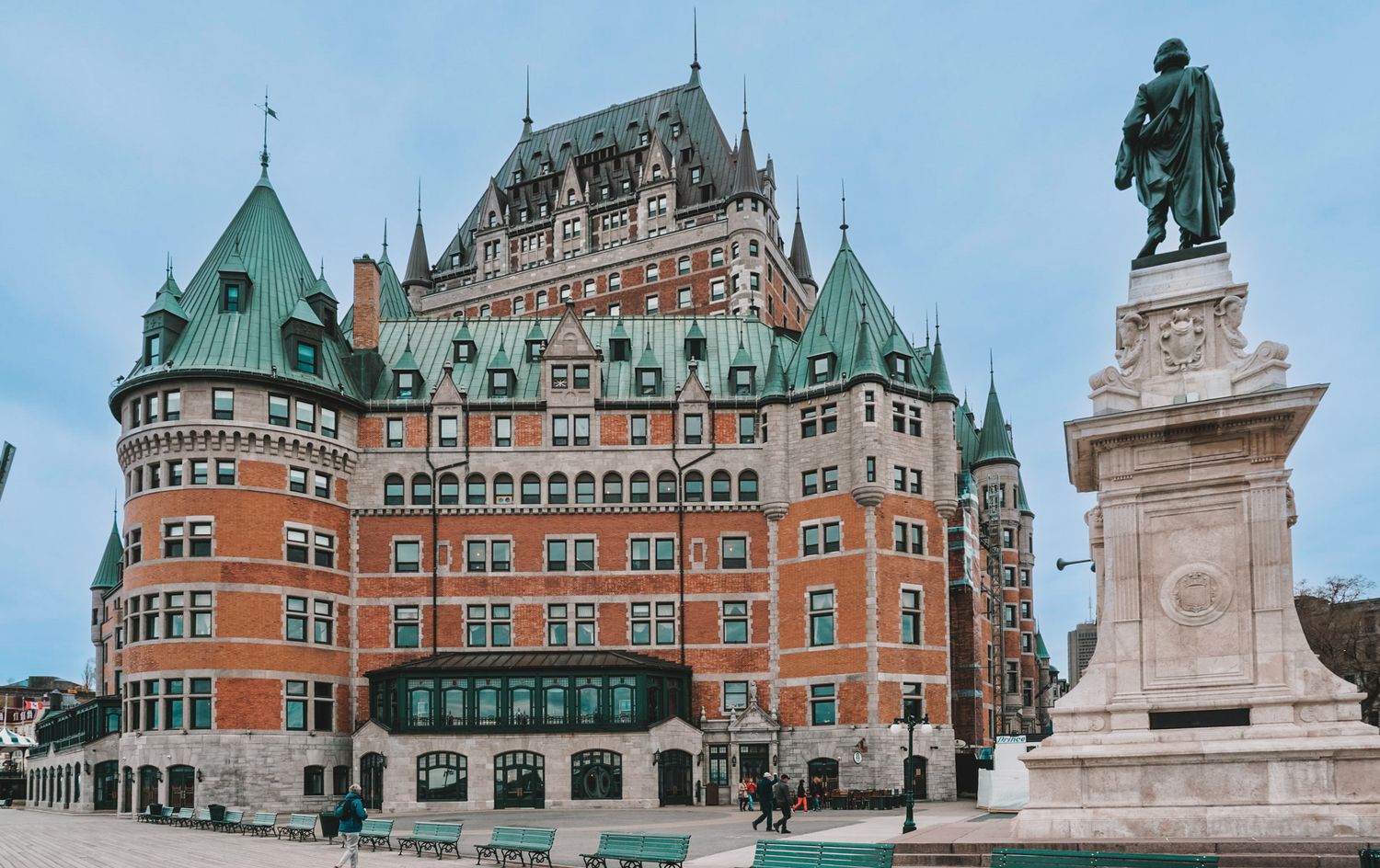 Historic Chateau Frontenac hotel in Quebec City with copper roofs and stone architecture.