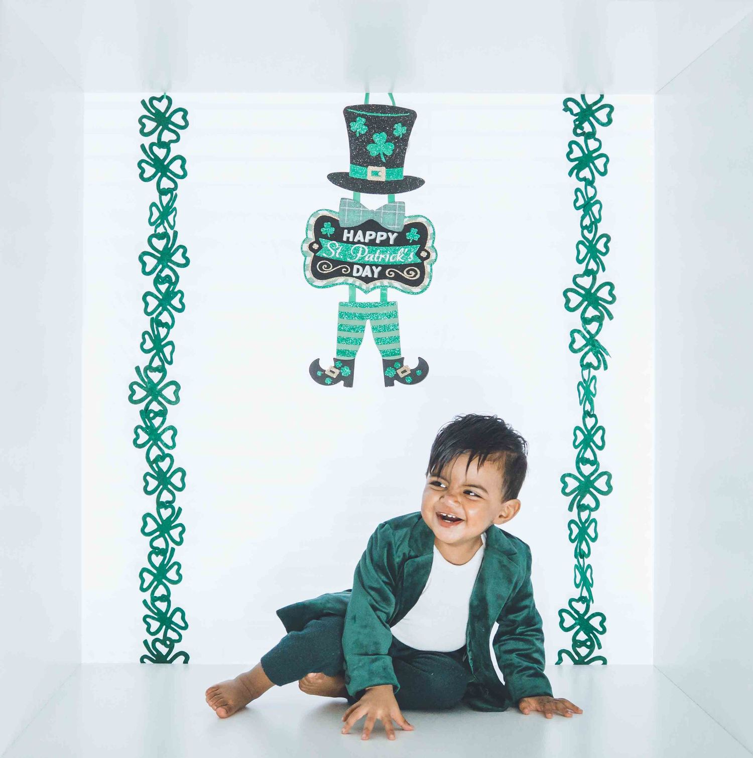 St Patrick's Day themed photo session with leprechaun decorations and green accents.