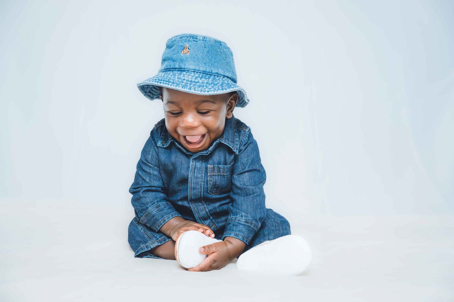 Expressive portrait series featuring denim clothing and natural reactions.