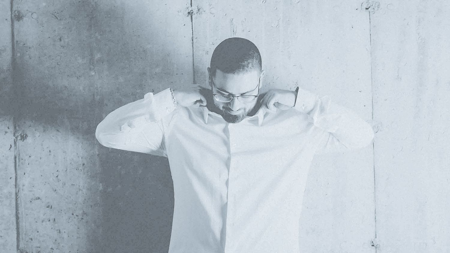 Professional portraits against white concrete wall in monochromatic style.