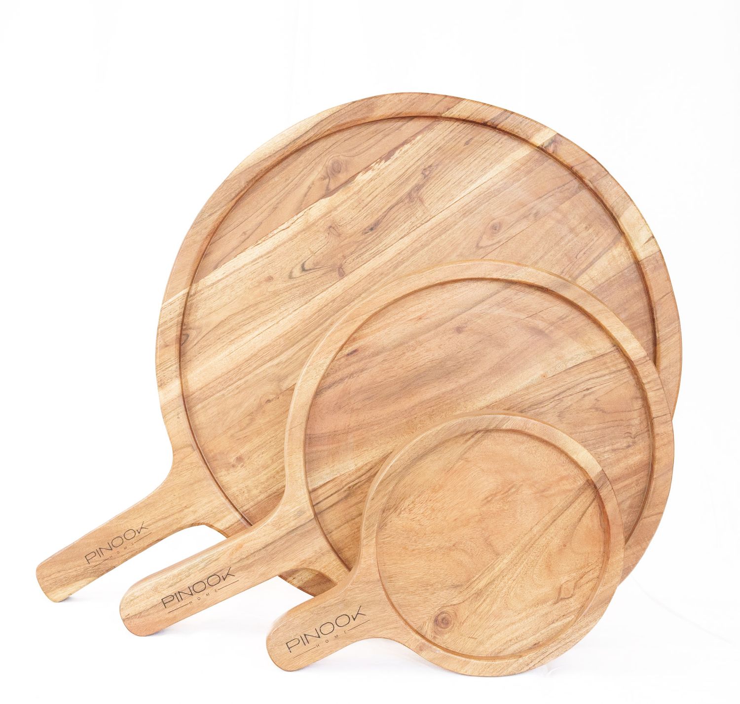 Set of three round wooden pizza boards with handles, stacked together, by PINOO.