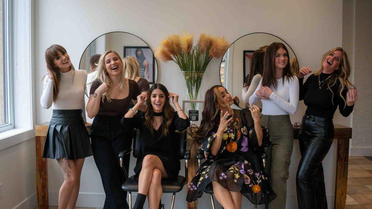 Panoramic view of a modern salon interior with stylish furnishings.