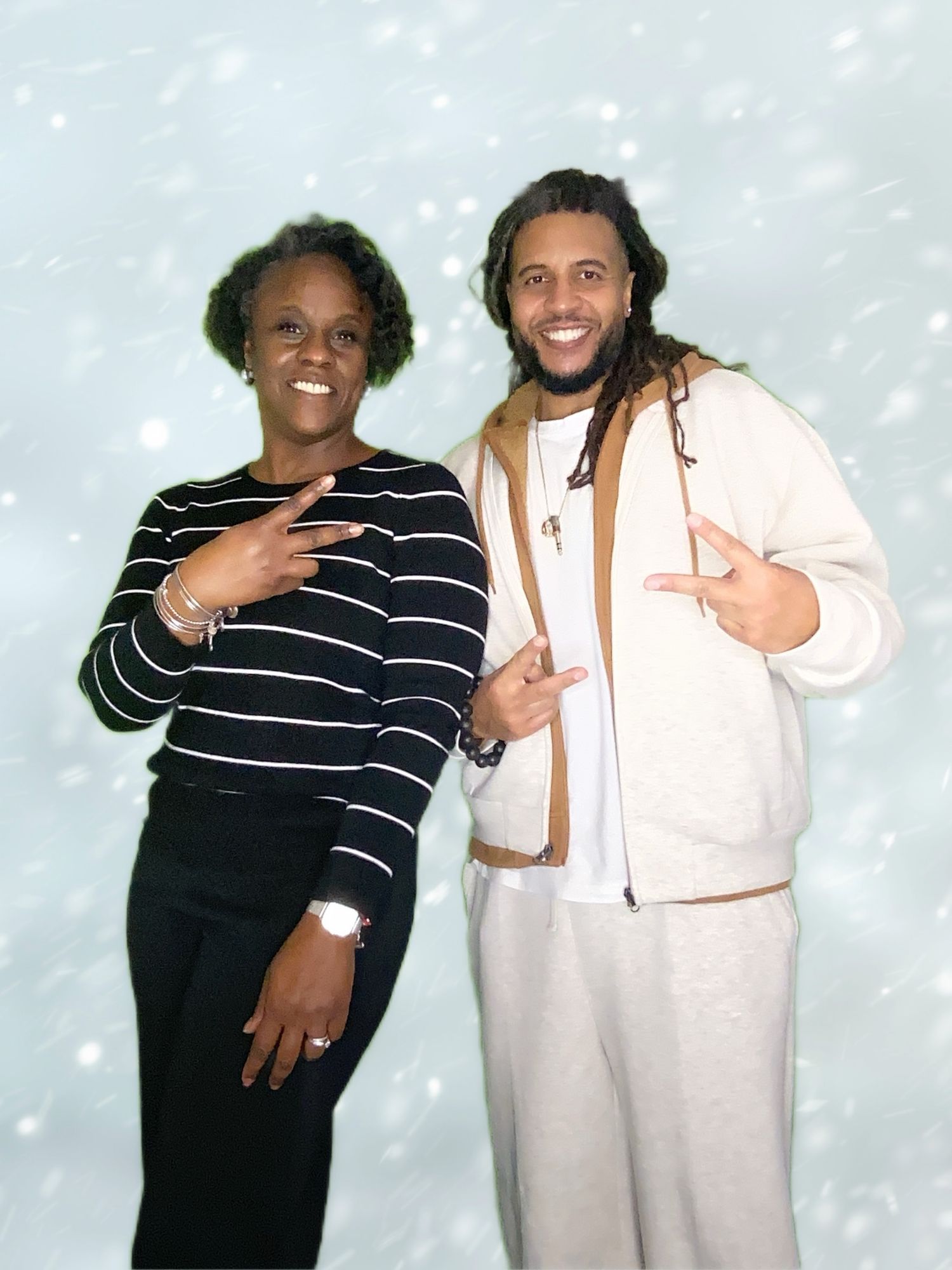 A studio portrait with a snowy effect background.