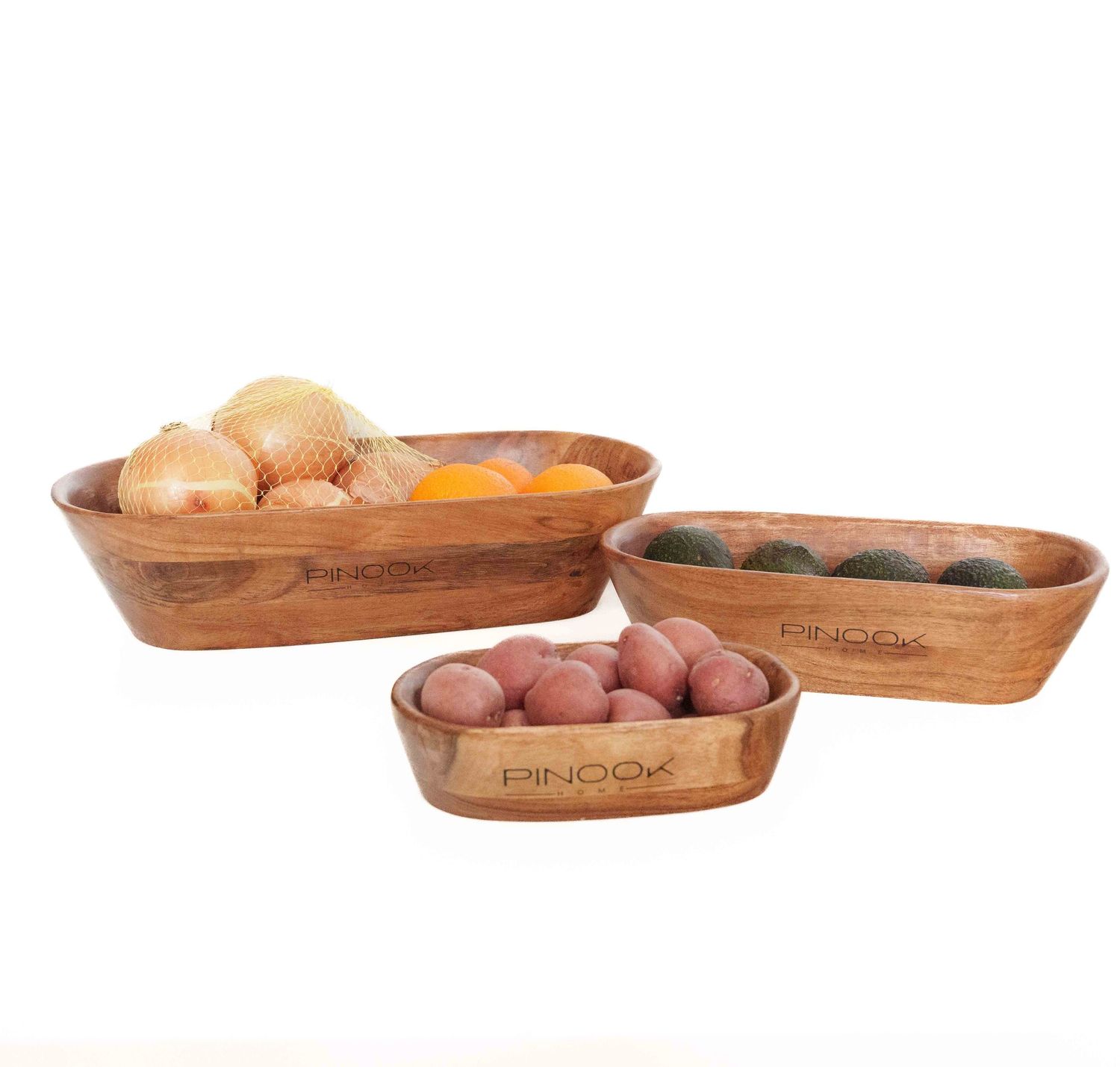 Set of three oval wooden bowls with vegetables including onions and potatoes, branded PINOO.