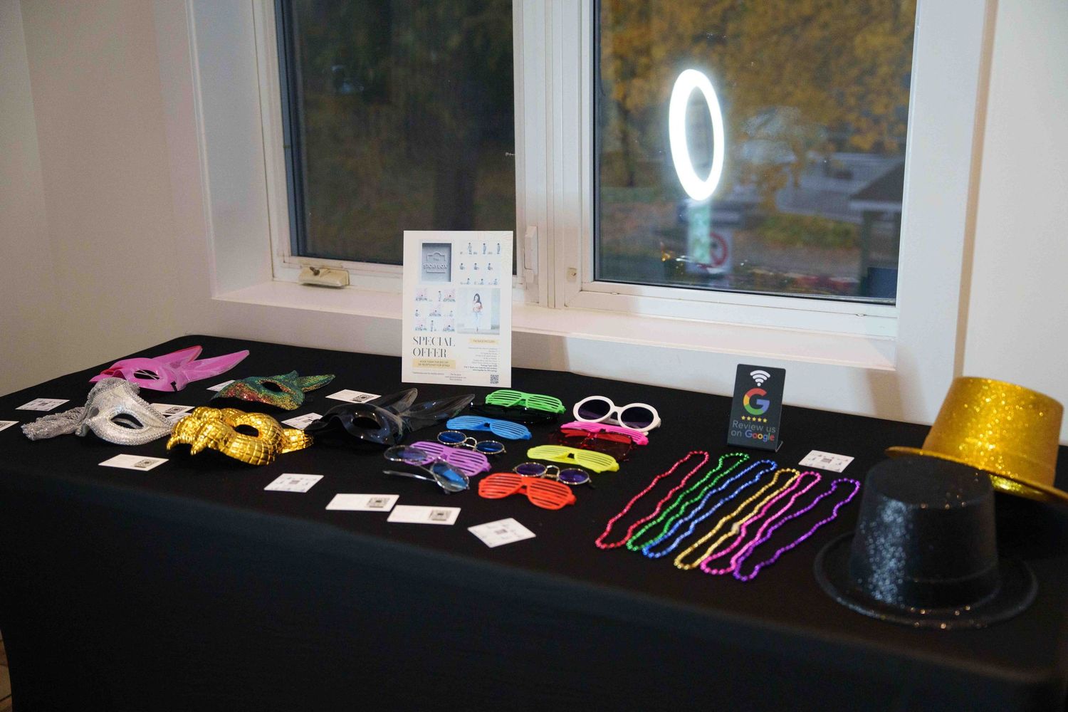 Display of colorful hair accessories and styling tools arranged on a dark counter.