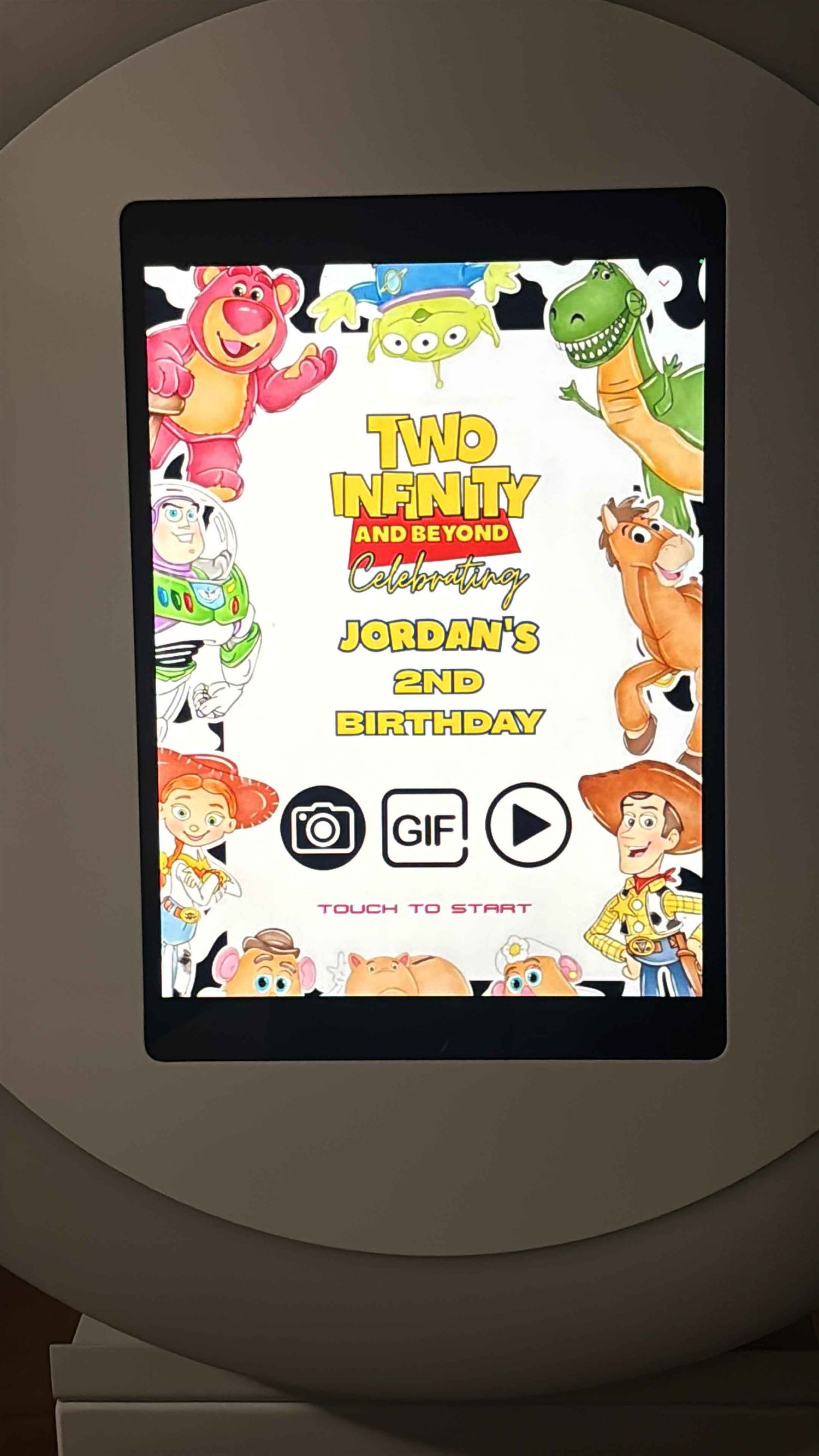 Animated birthday celebration screen with colorful cartoon characters and interactive buttons.