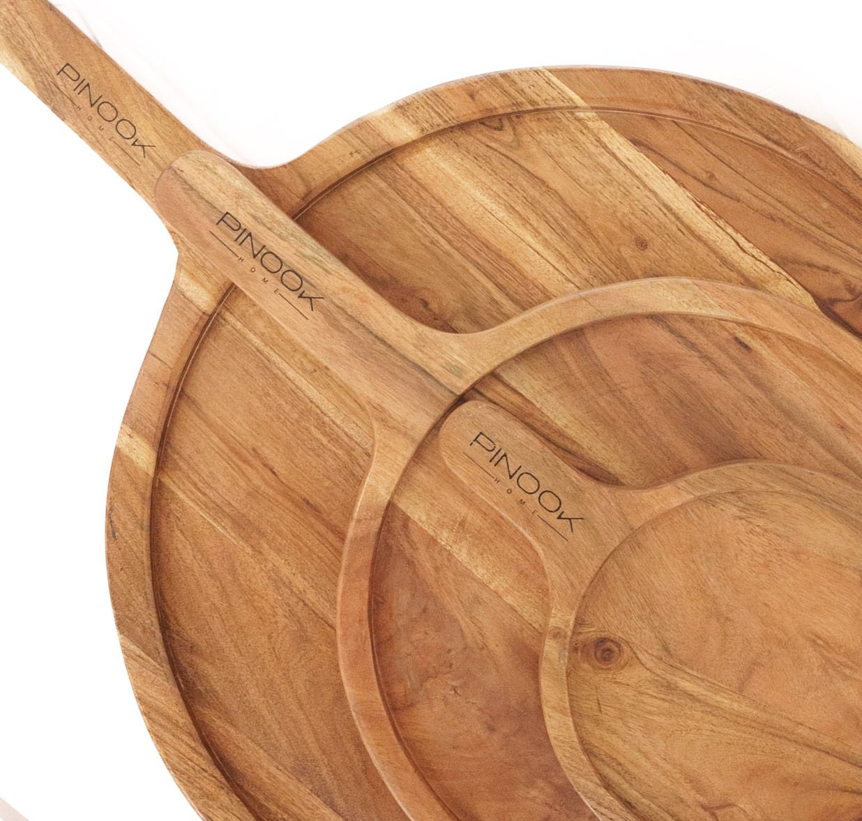 Three PINOOK branded round acacia wood serving boards of varying sizes stacked together with a long handle.