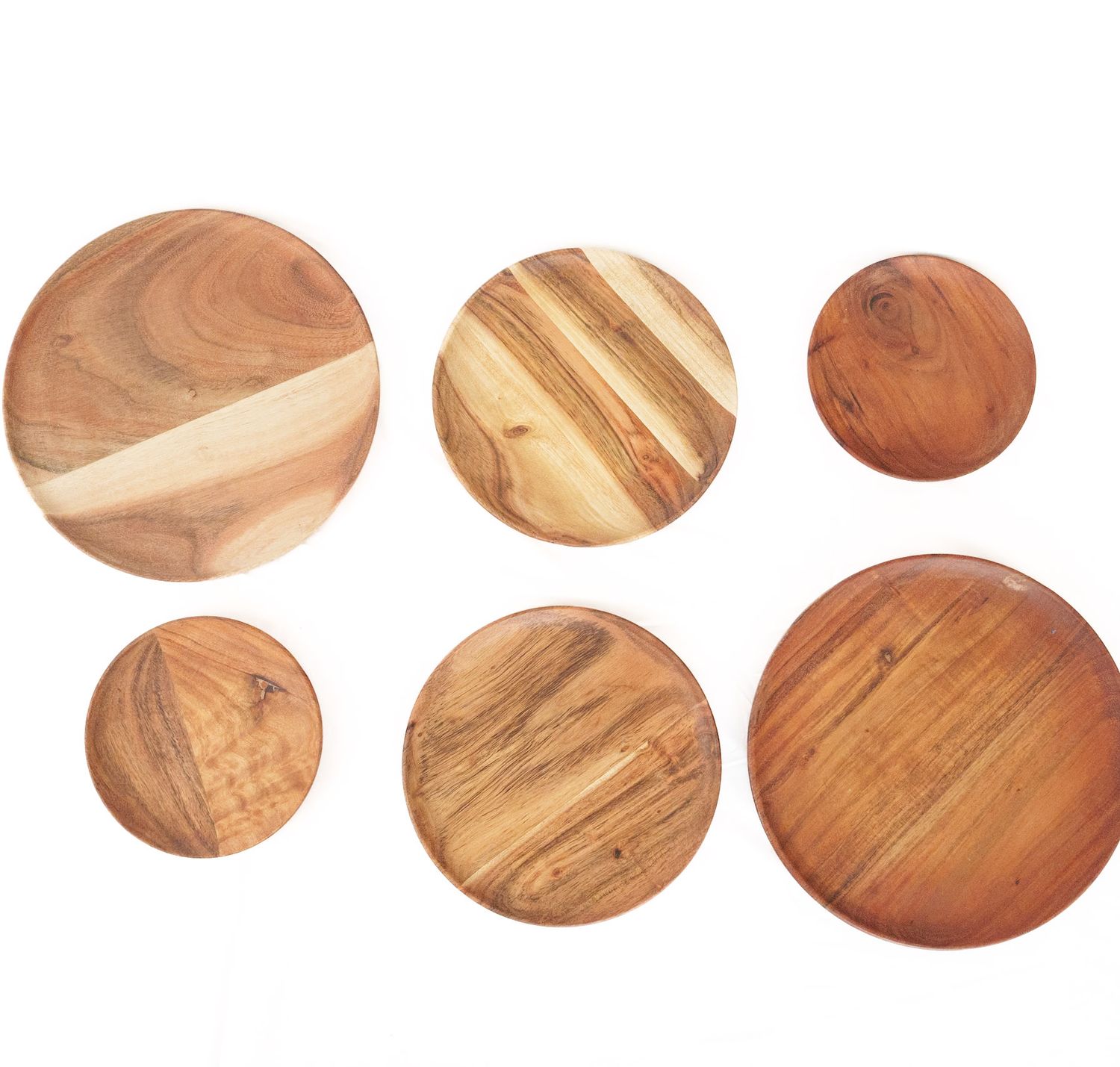 Six round Pinook acacia wood serving boards in various sizes showing natural wood grain patterns.