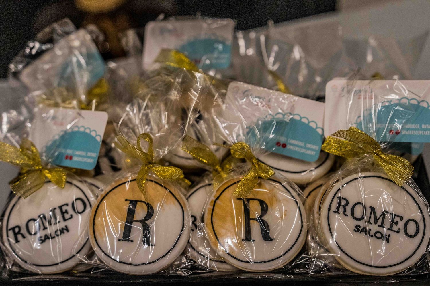 Row of wrapped party favors with decorative ribbons.