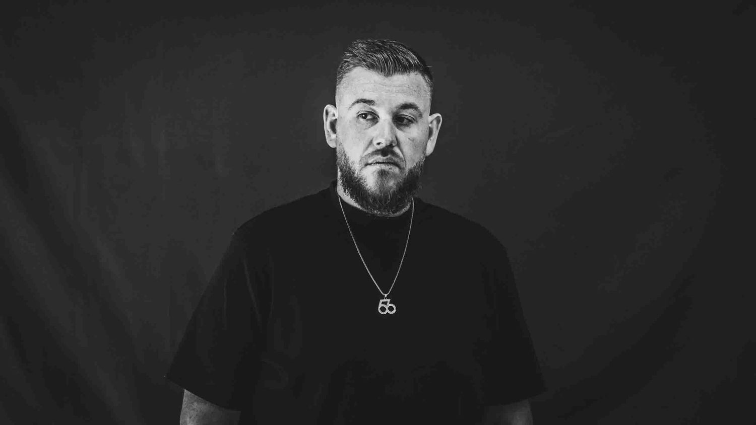 Black and white portrait series with dark background and dramatic lighting.