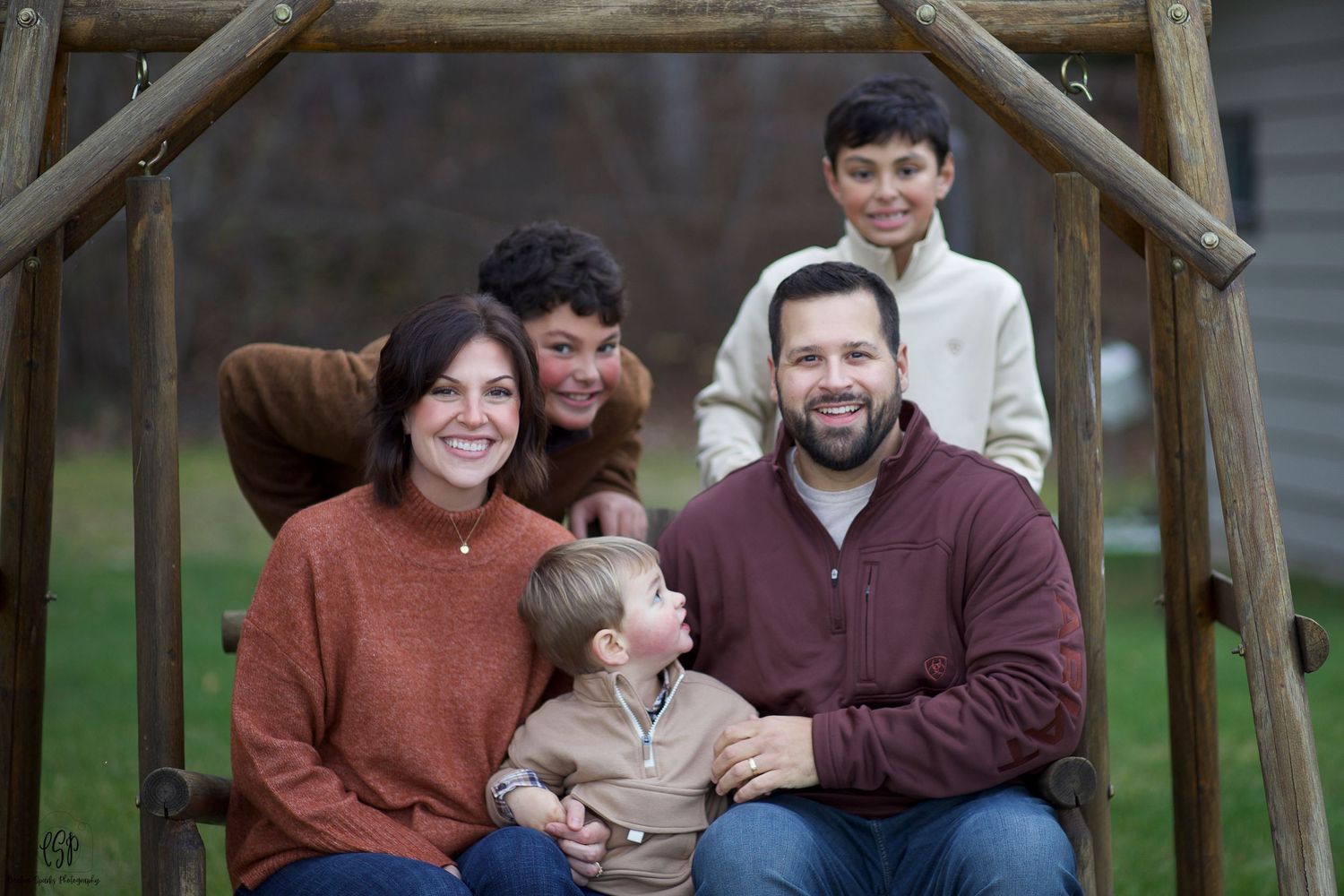 Professional family portrait photographer in Northern Minnesota photographing parents and children