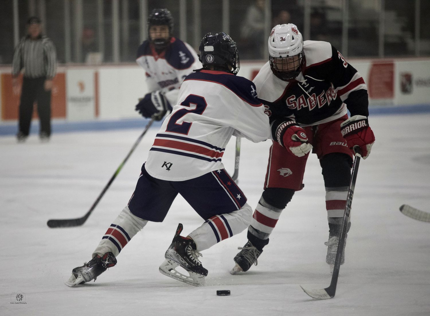 Northern MN hockey action shot capturing intensity, movement, and athletic performance