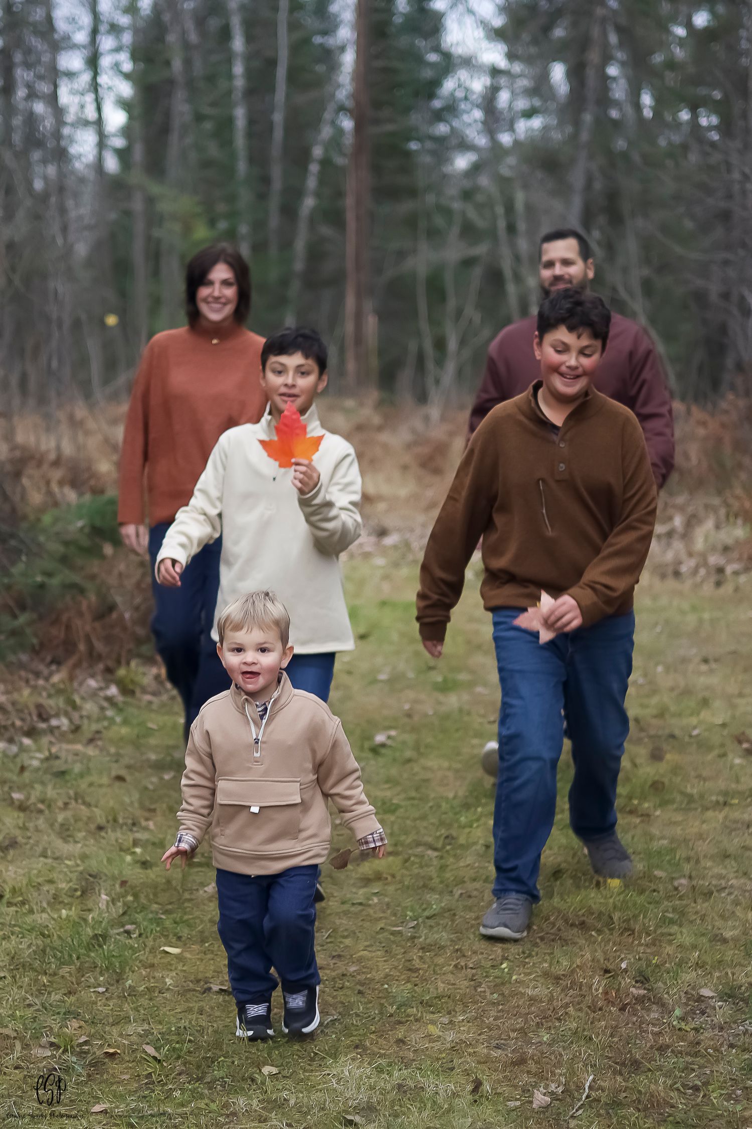 Professional family portrait photographer in Northern Minnesota photographing parents and children