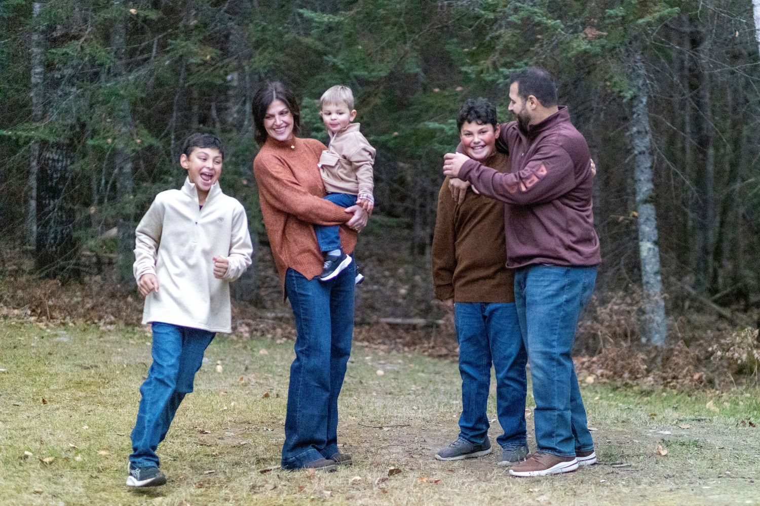 Outdoor family portraits in Northern MN featuring relaxed, natural poses and real moments