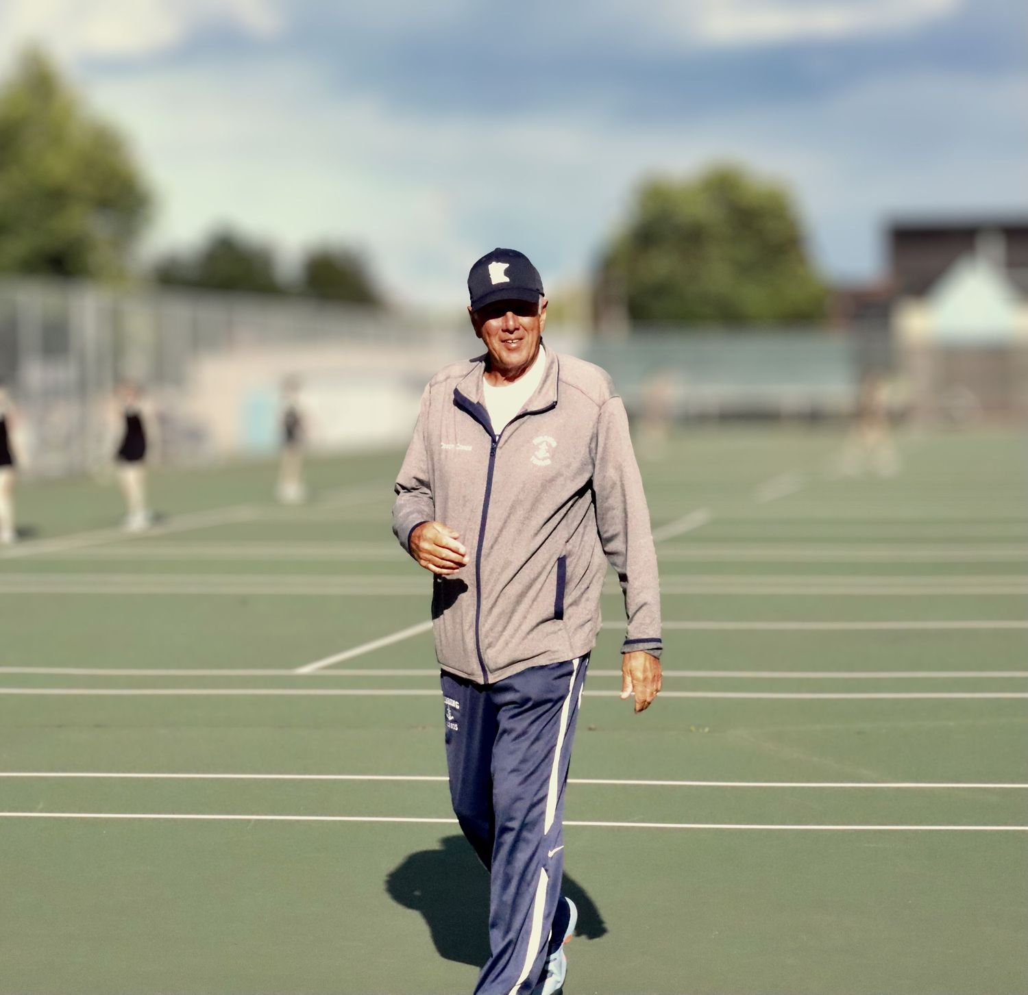 Professional photographer capturing candid moments on the tennis court.